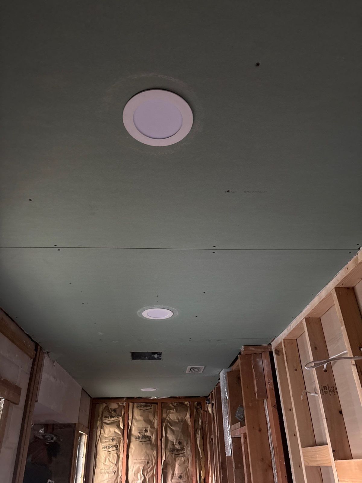 New drywall ceiling with recessed lights during a master bath remodel